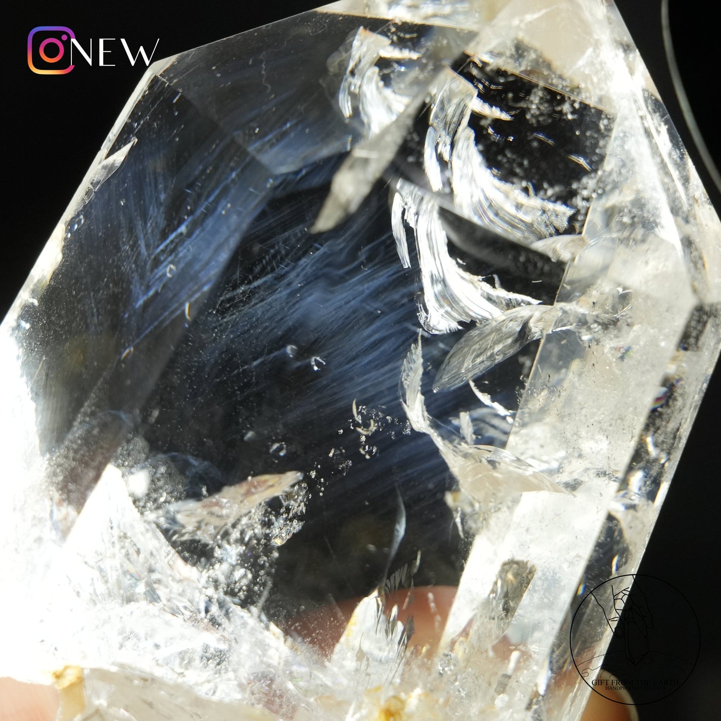 Half-polished blue needle quartz point