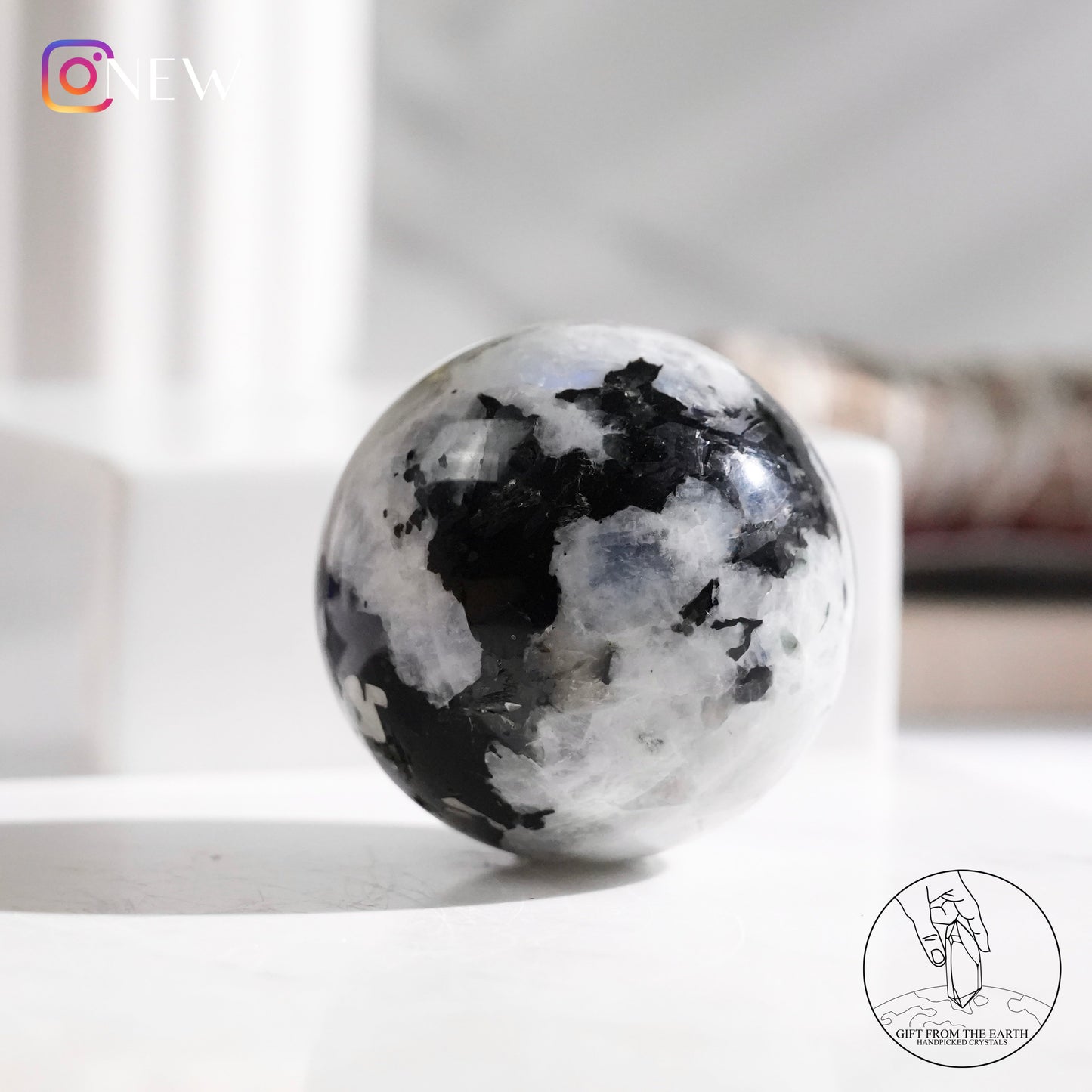 Indian white moonstone with black tourmaline sphere