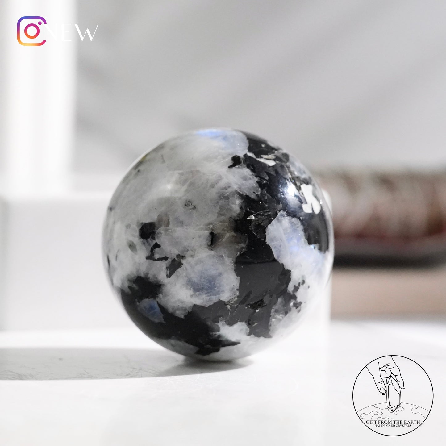 Indian white moonstone with black tourmaline sphere