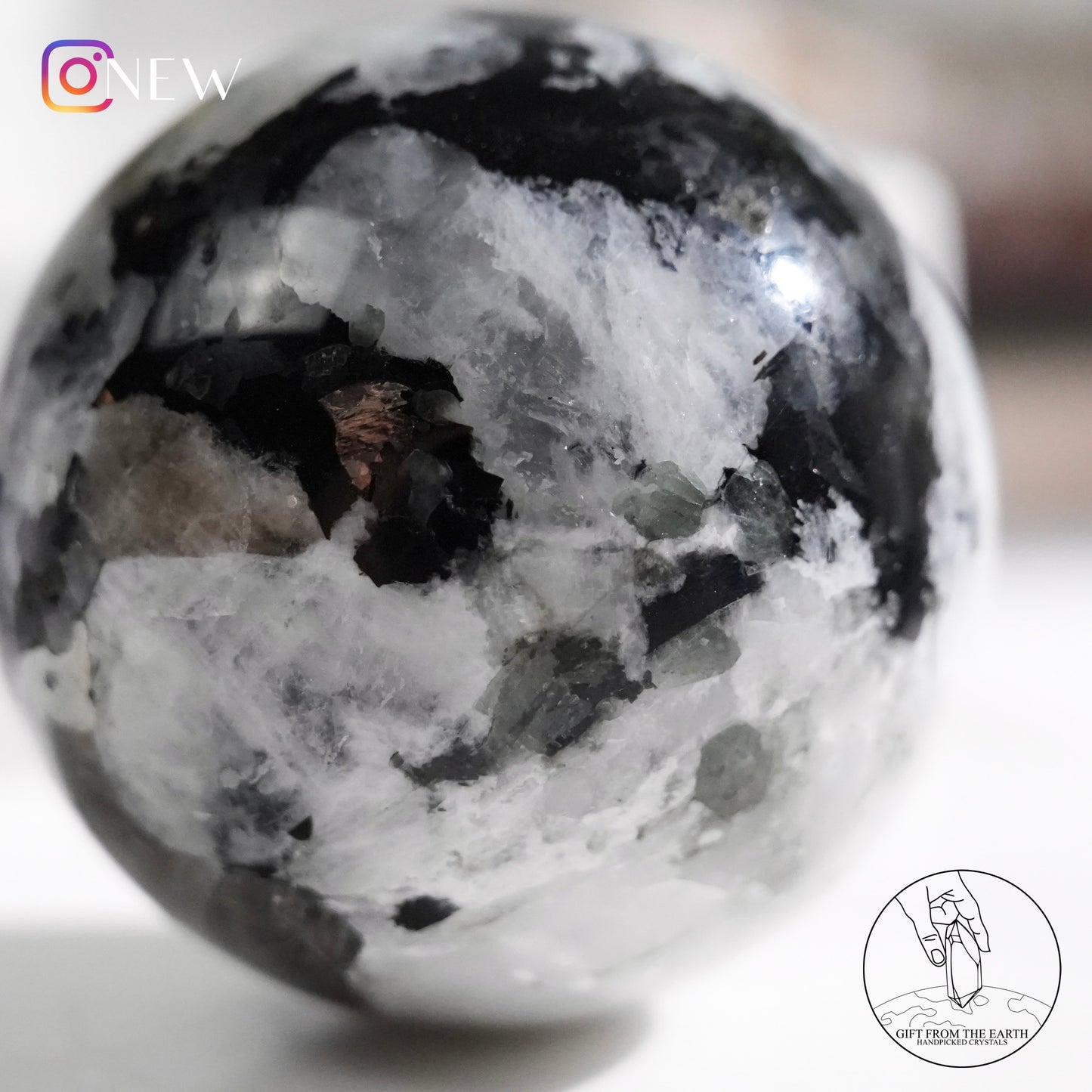 Indian white moonstone with black tourmaline sphere