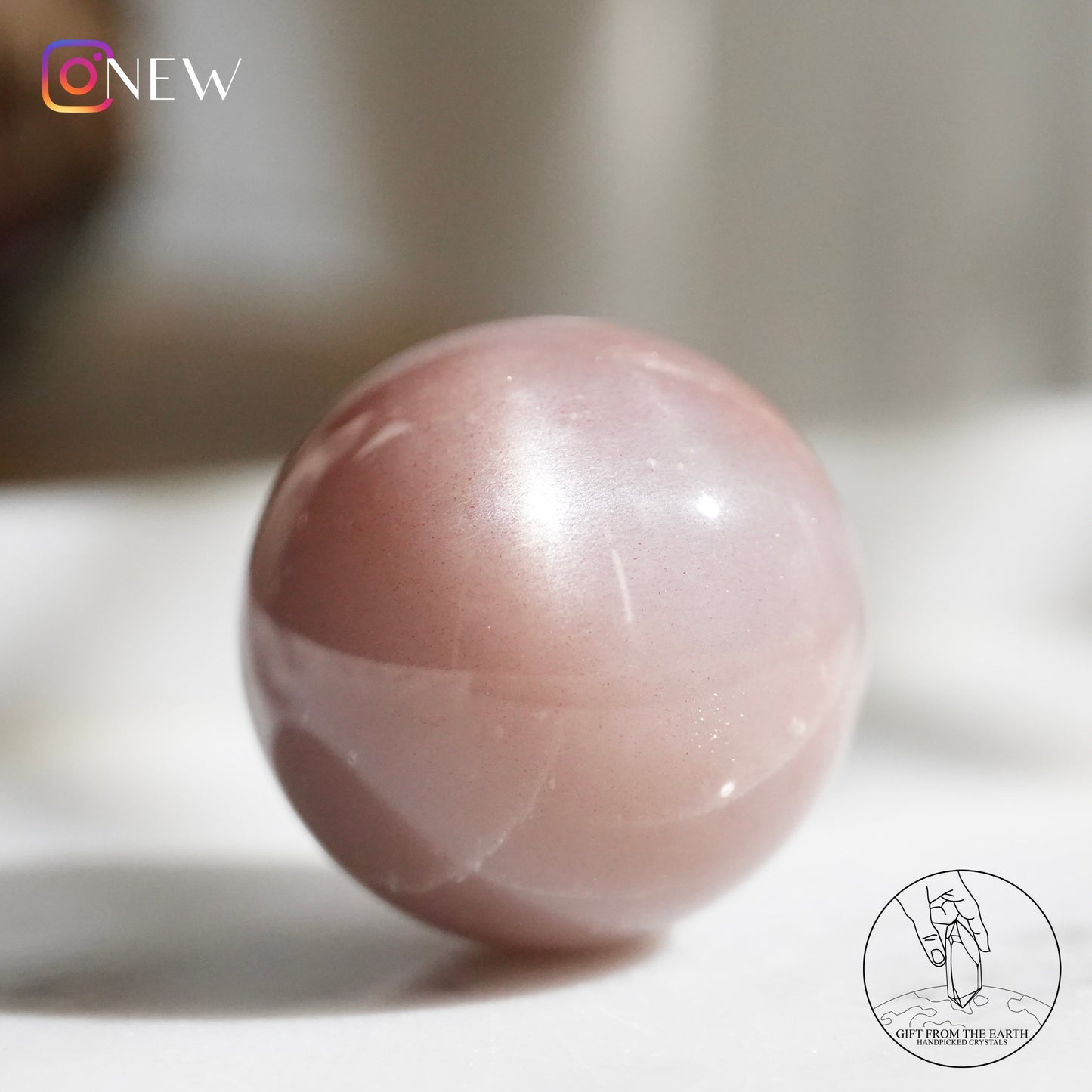 Orange moonstone sphere with sunstone