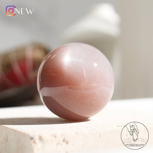 Orange moonstone sphere with sunstone