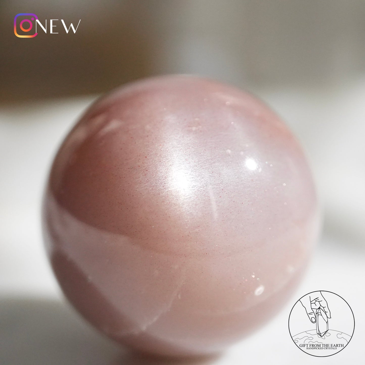 Orange moonstone sphere with sunstone