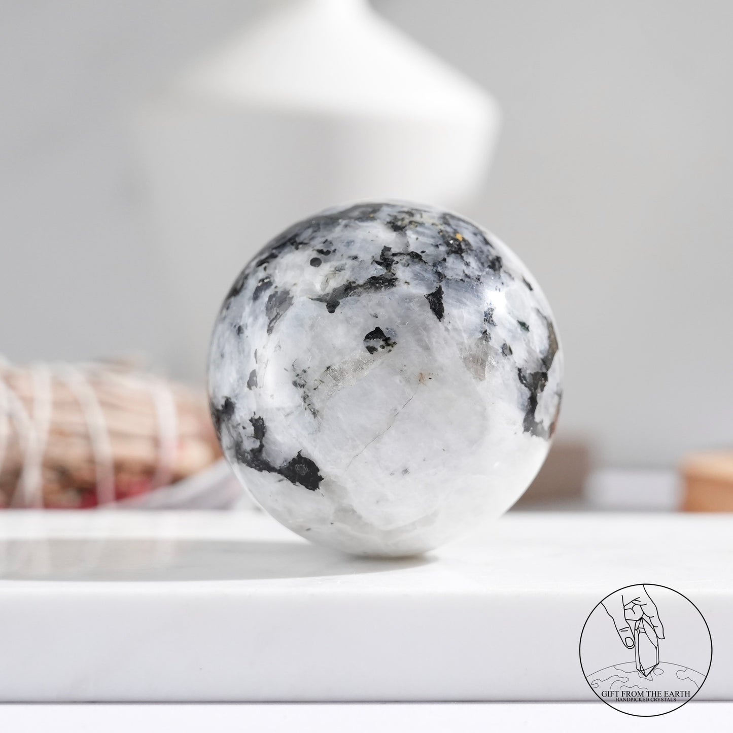 Indian white moonstone with black tourmaline sphere