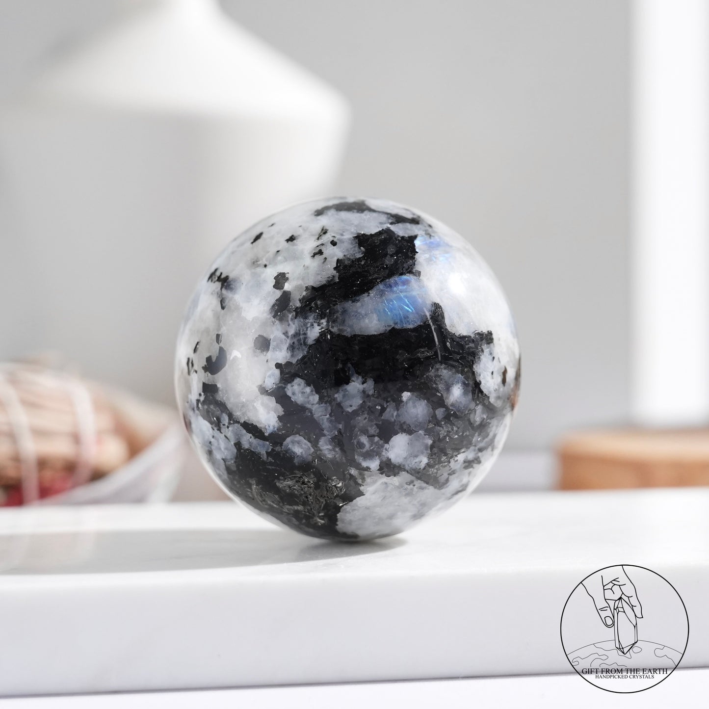 Indian white moonstone with black tourmaline sphere