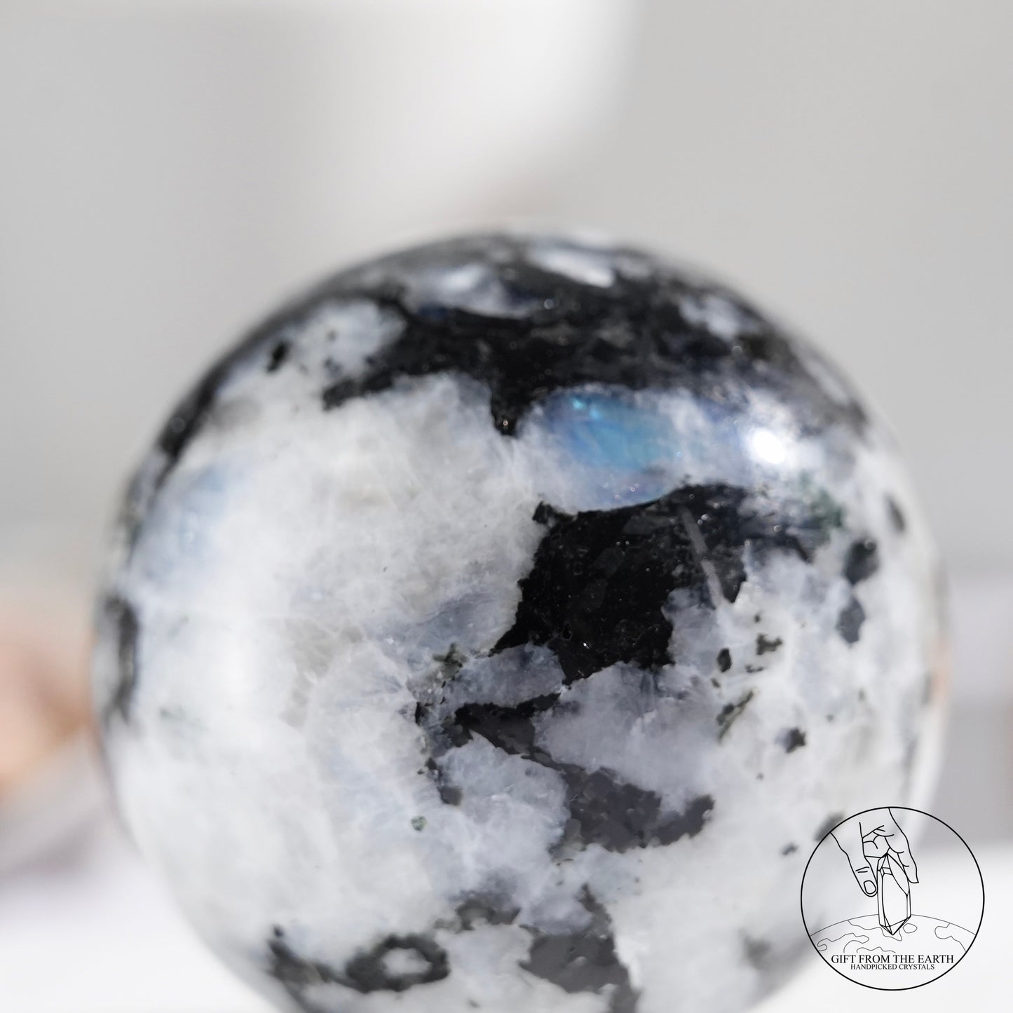 Indian white moonstone with black tourmaline sphere