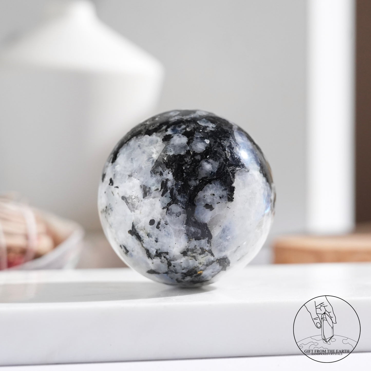 Indian white moonstone with black tourmaline sphere