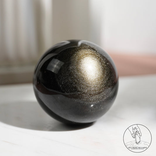 Golden sheen obsidian sphere