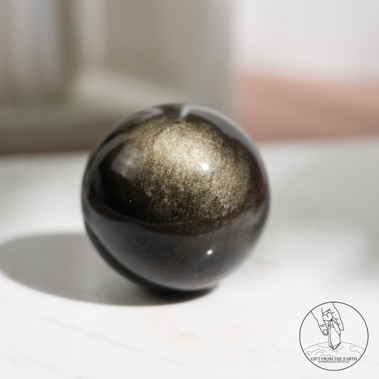 Golden sheen obsidian sphere