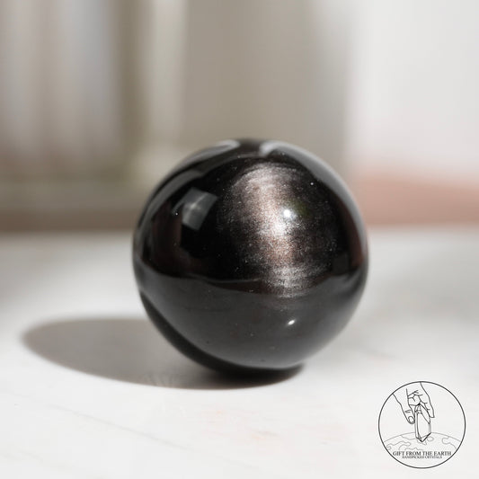 Silver sheen obsidian sphere