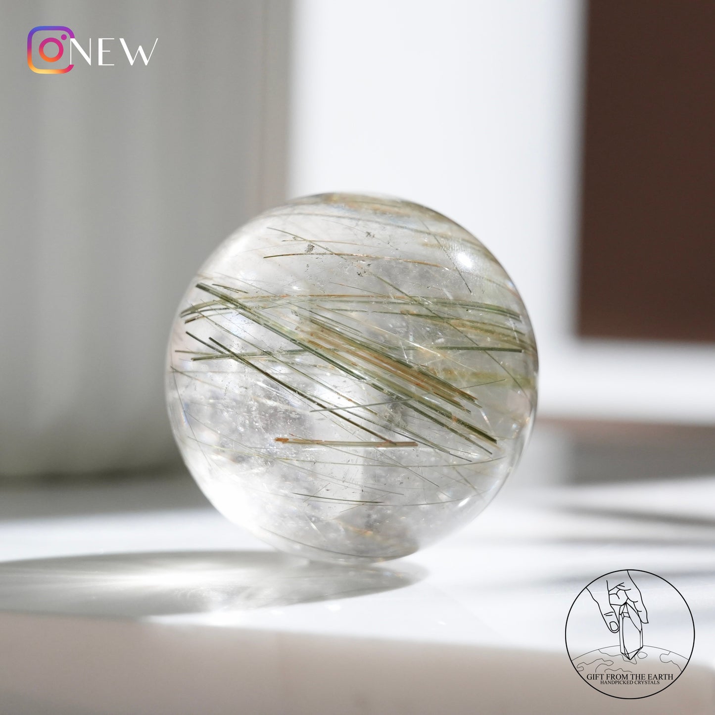 Green rutilated quartz sphere