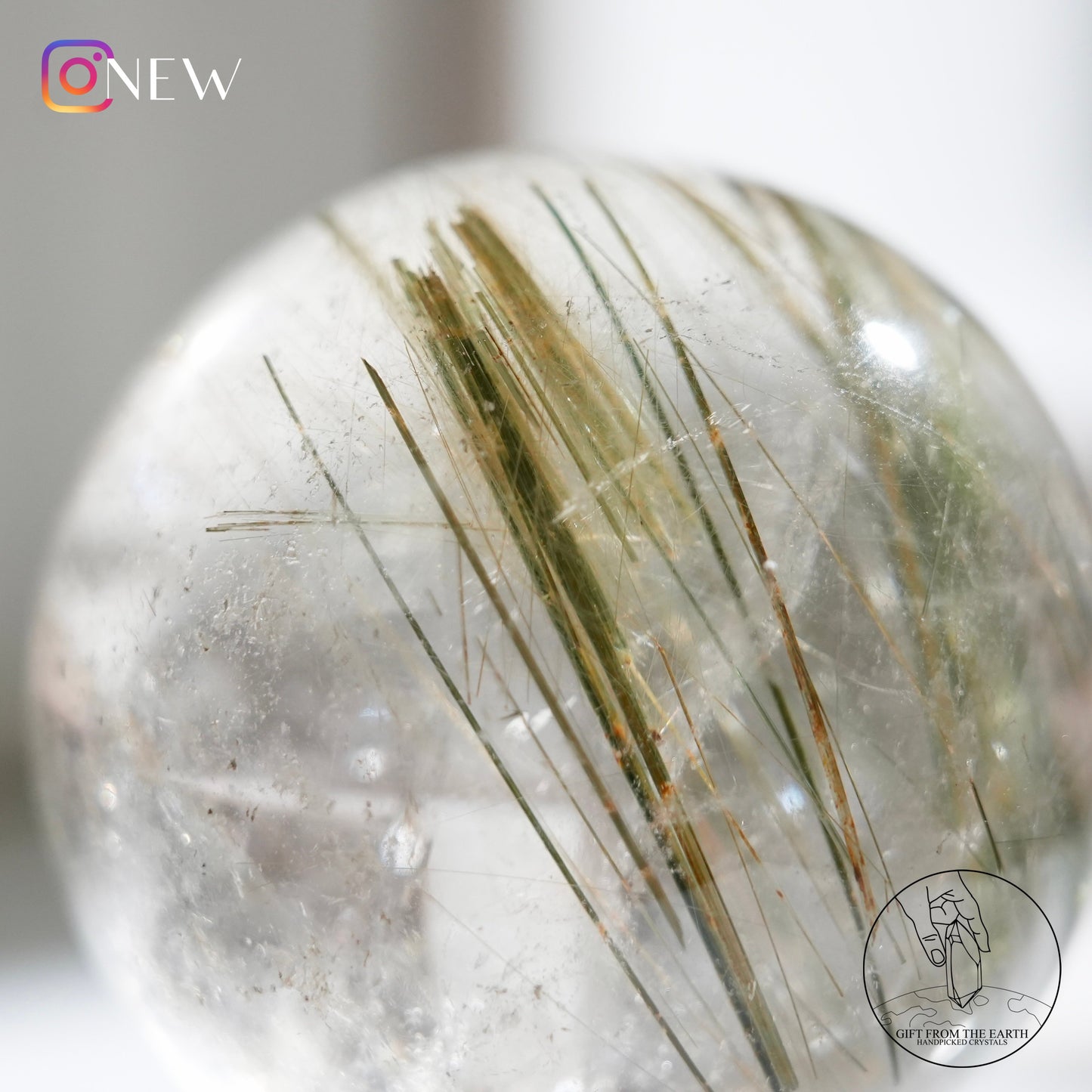 Green rutilated quartz sphere