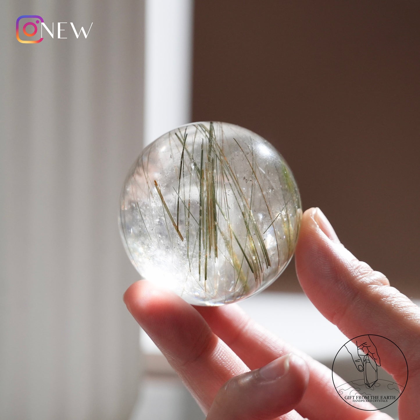 Green rutilated quartz sphere