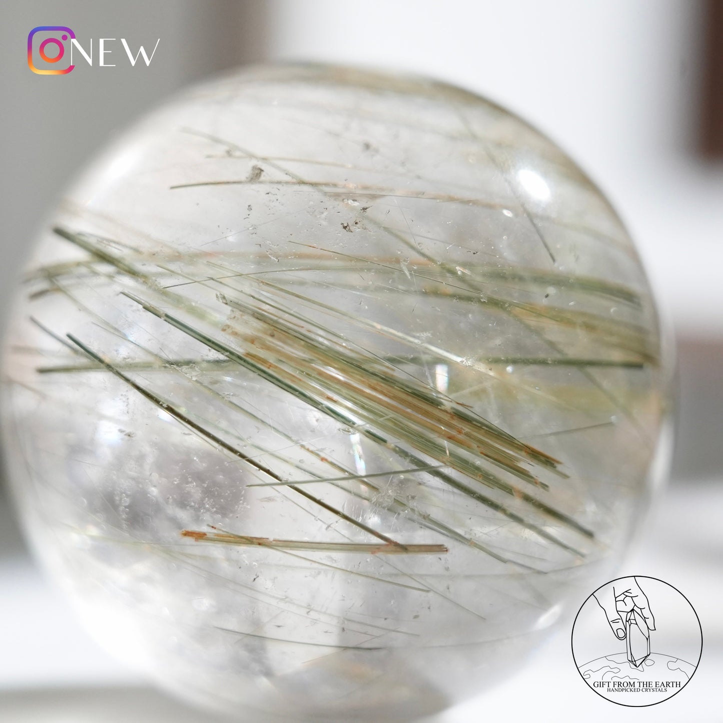 Green rutilated quartz sphere