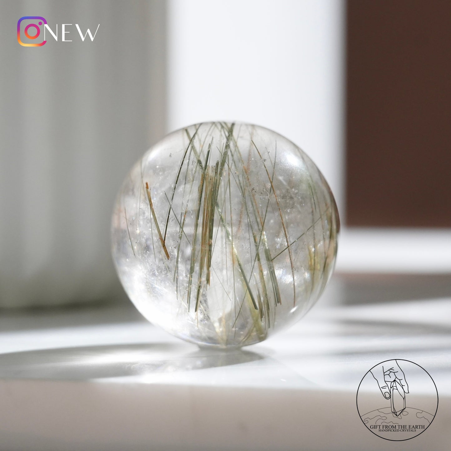 Green rutilated quartz sphere