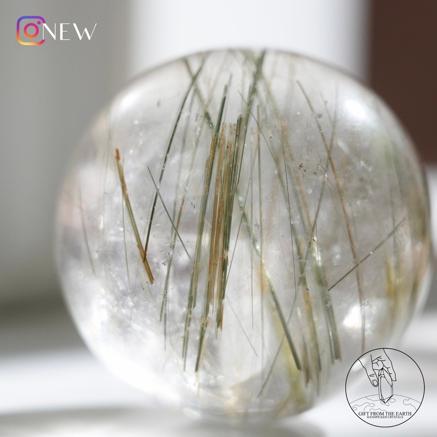 Green rutilated quartz sphere