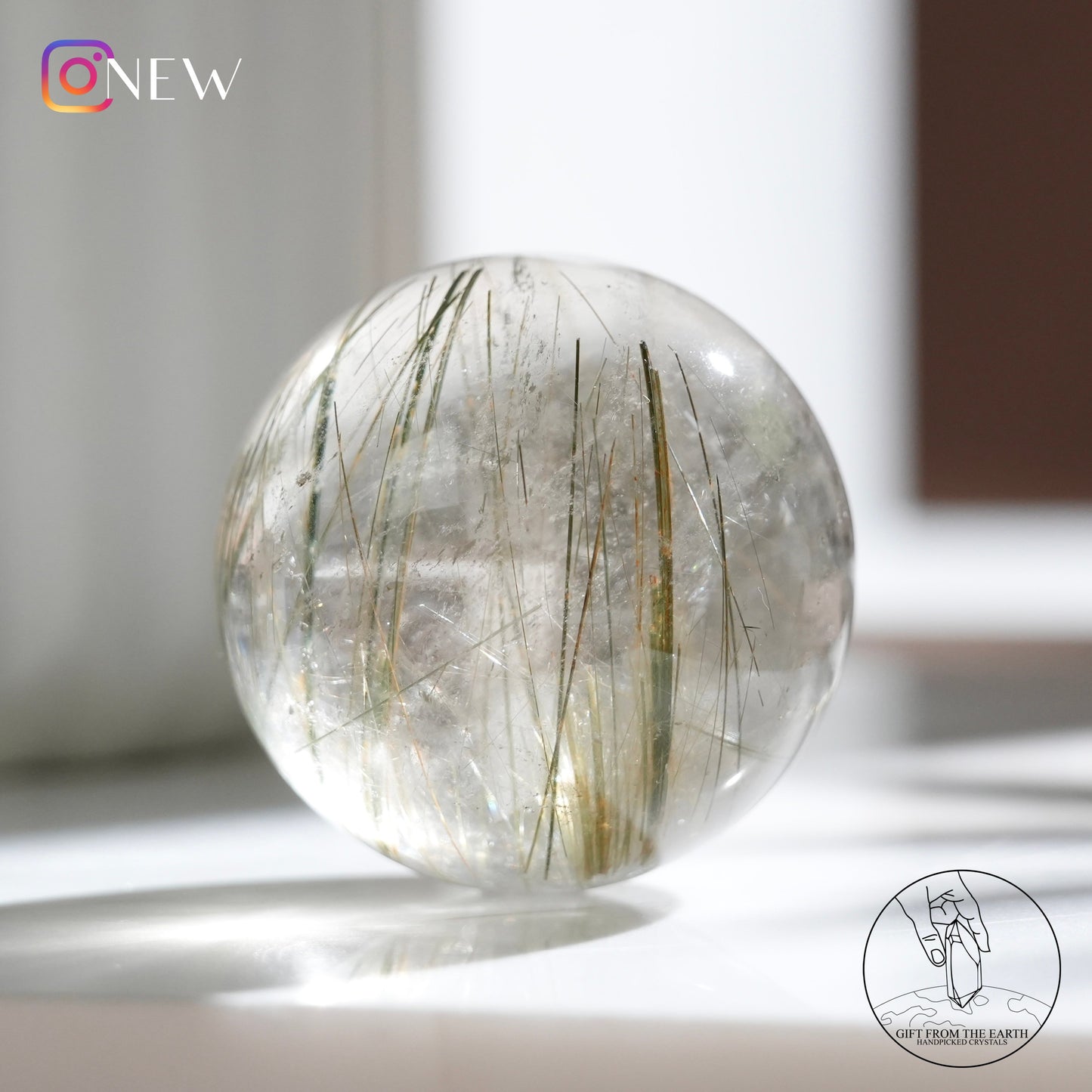 Green rutilated quartz sphere