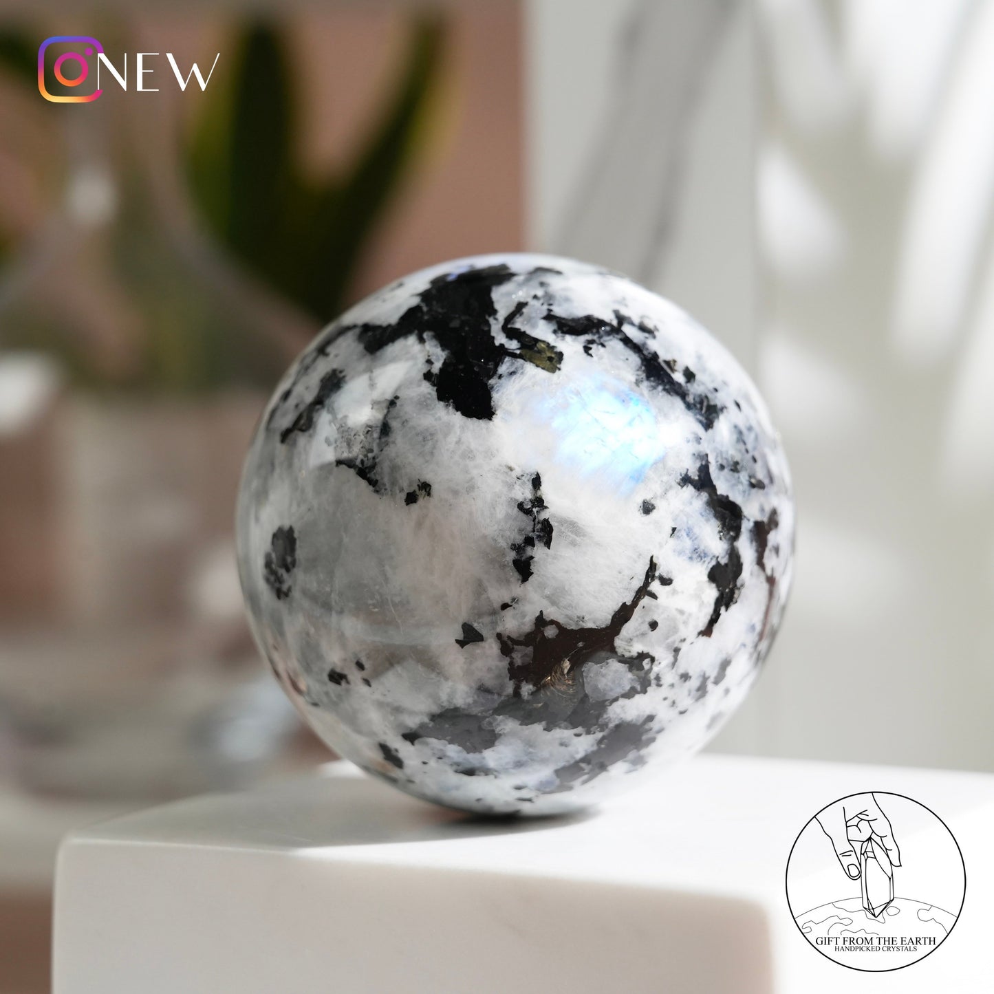 Indian white moonstone with black tourmaline sphere