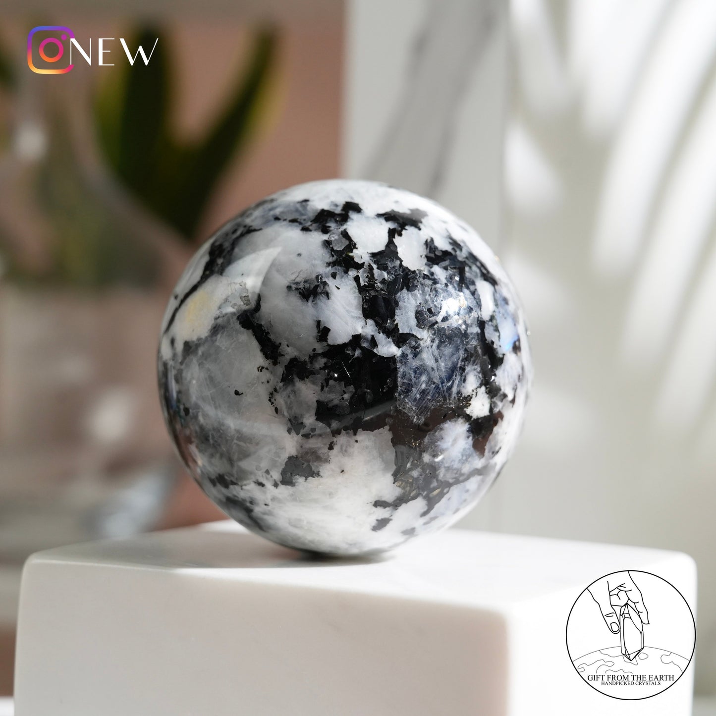 Indian white moonstone with black tourmaline sphere