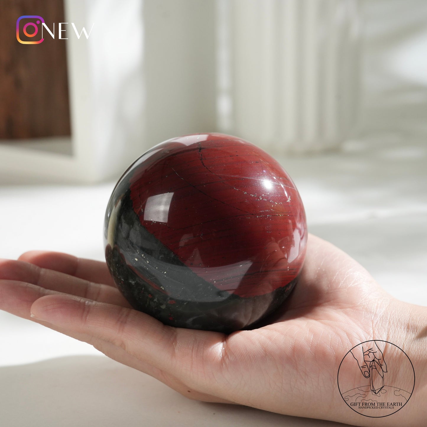 Bloodstone sphere with pyrite