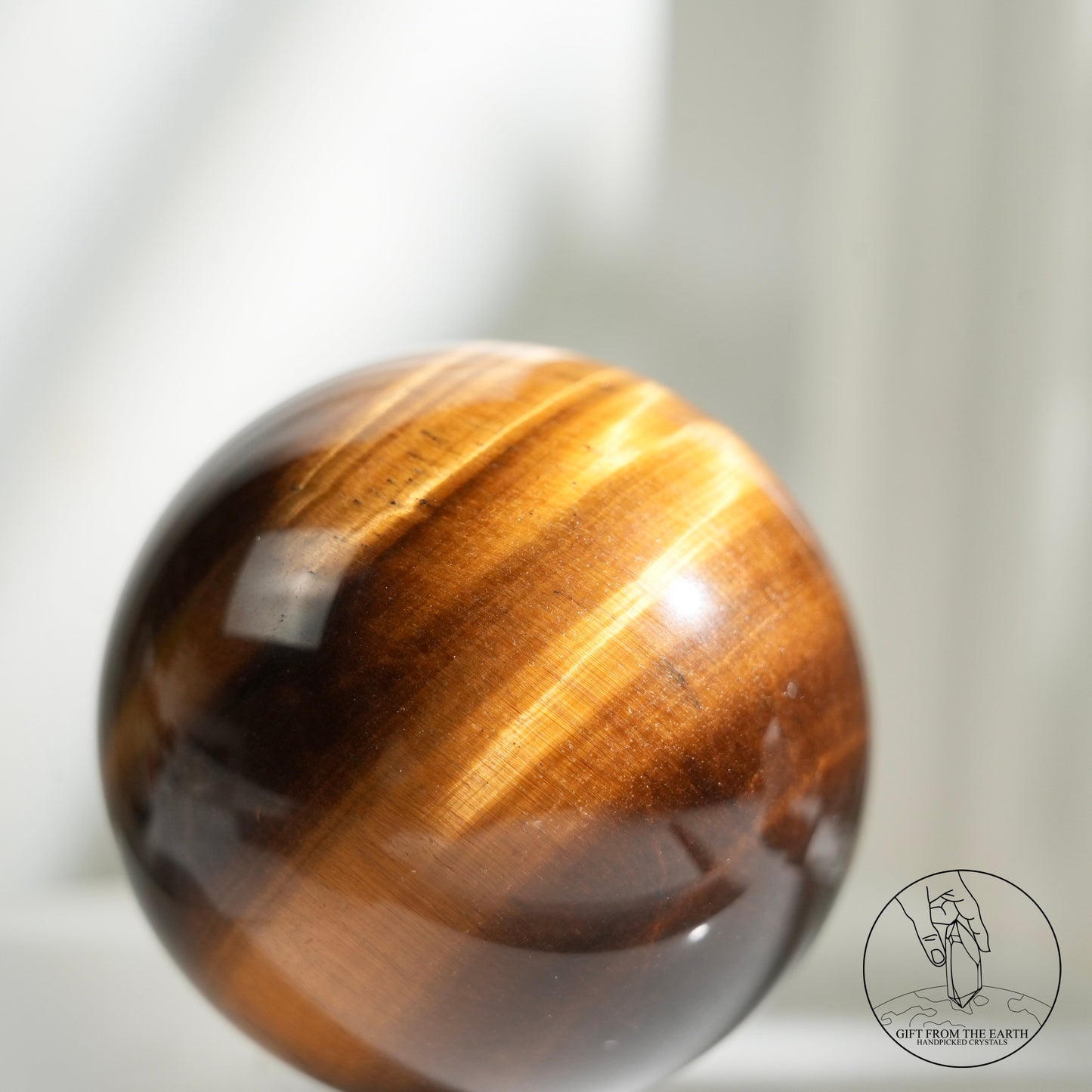 Yellow tiger's eye sphere