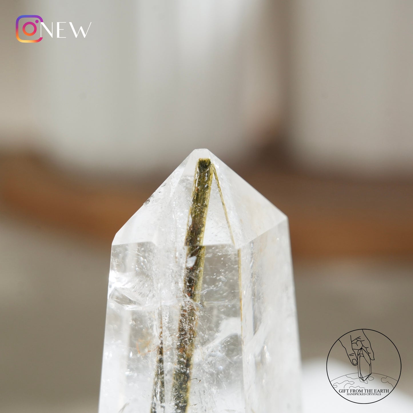 Green tourmaline in clear quartz point