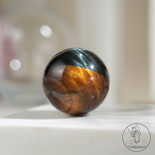 Blue-yellow tiger’s eye sphere