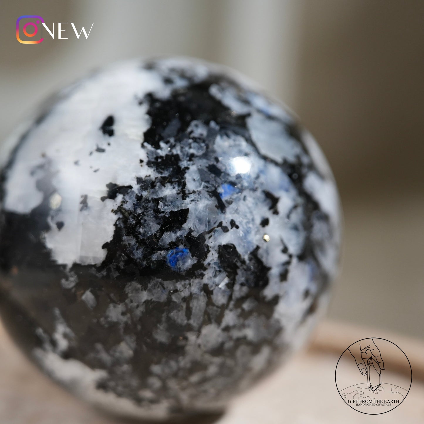 Indian white moonstone with black tourmaline sphere