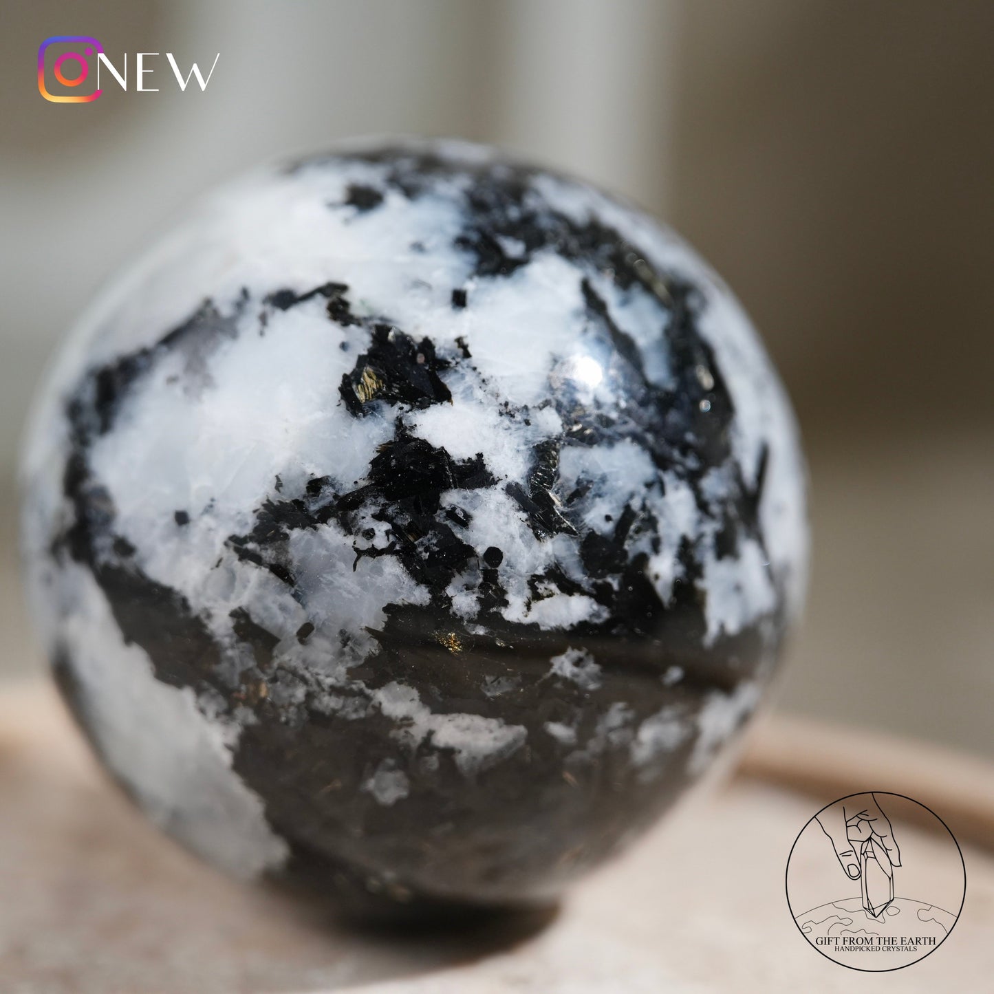 Indian white moonstone with black tourmaline sphere