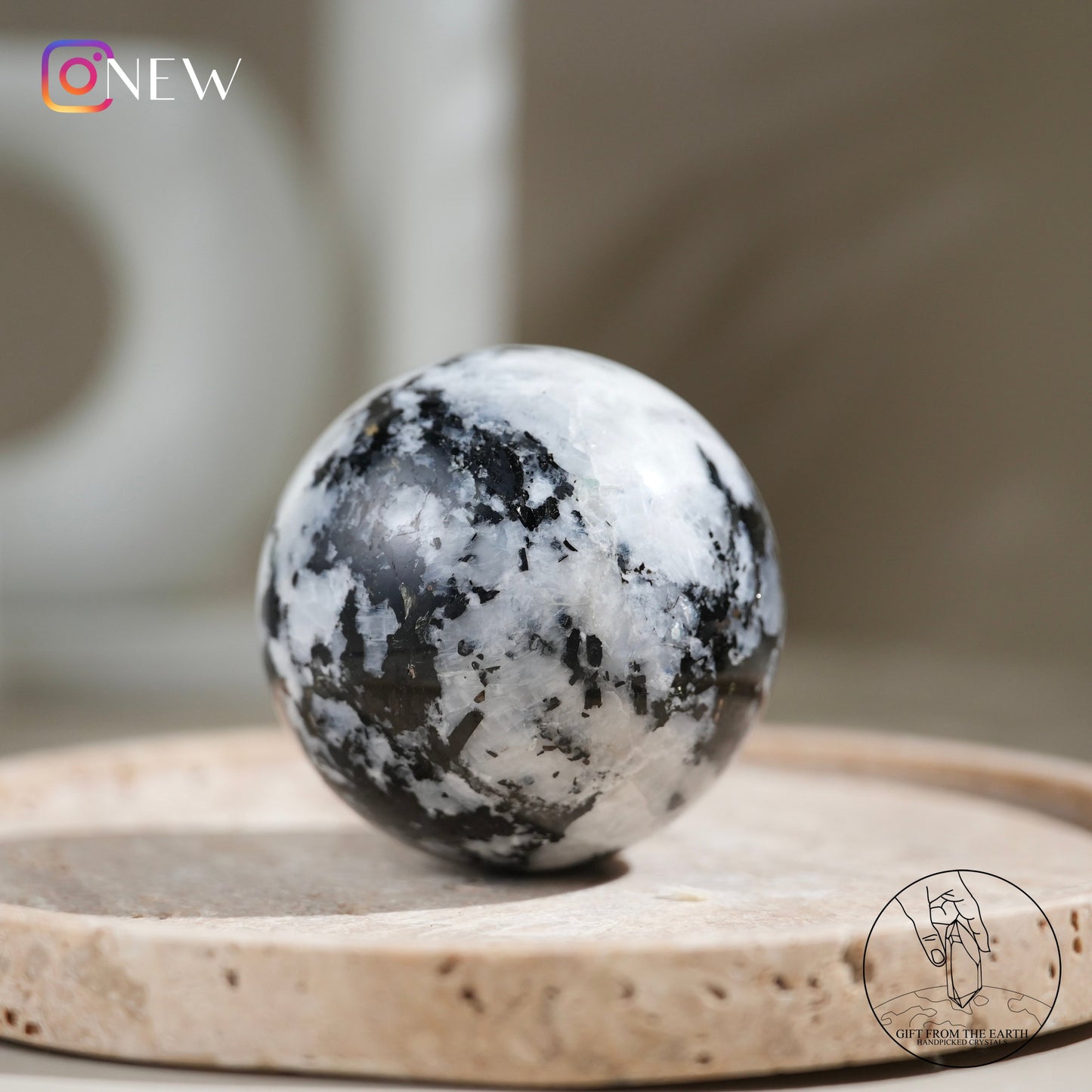 Indian white moonstone with black tourmaline sphere