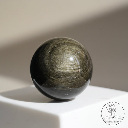 Golden obsidian sphere