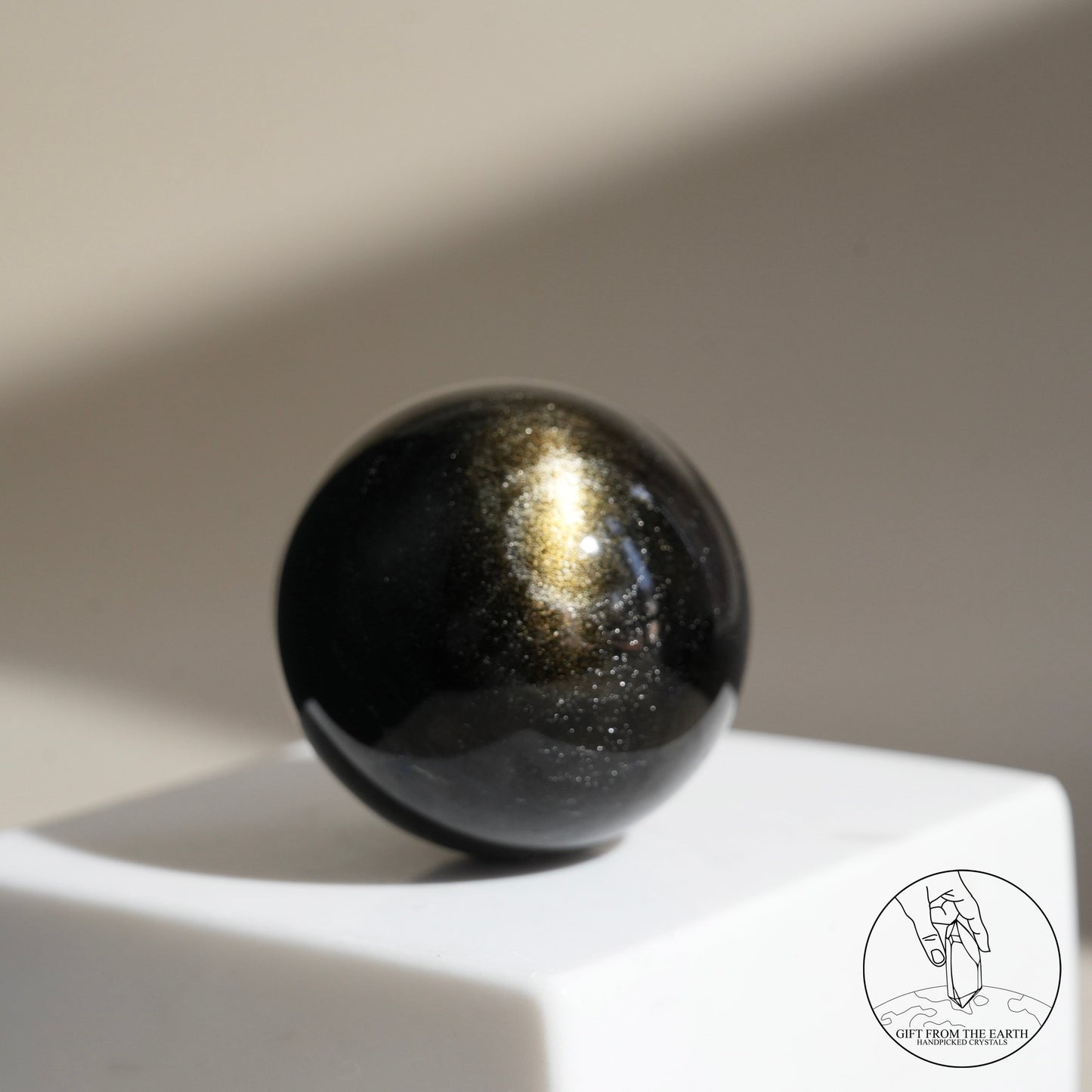 Golden obsidian sphere