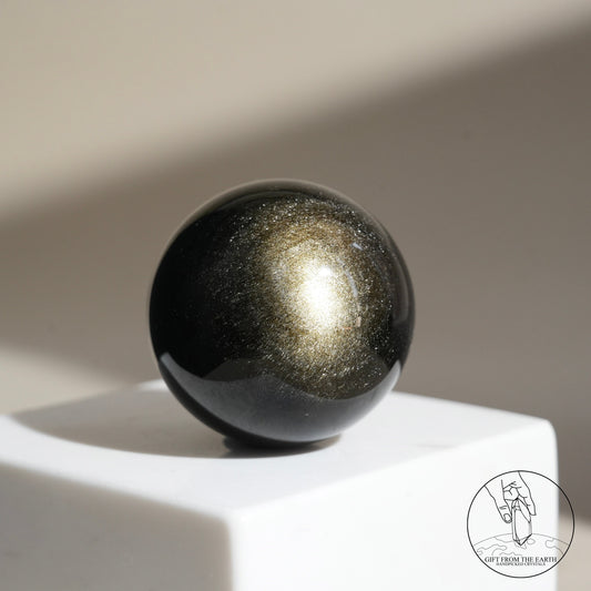 Golden obsidian sphere