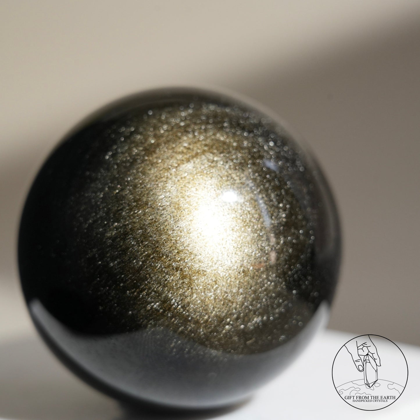 Golden obsidian sphere