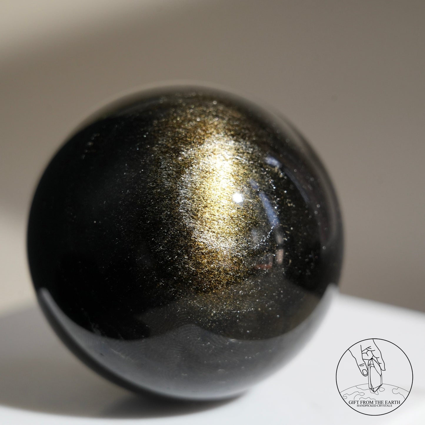 Golden obsidian sphere