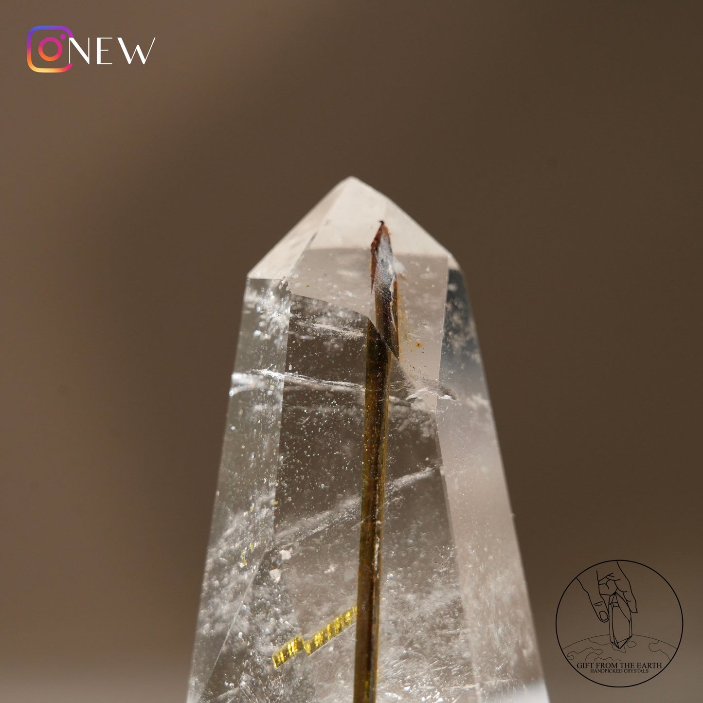 Green tourmaline in clear quartz point