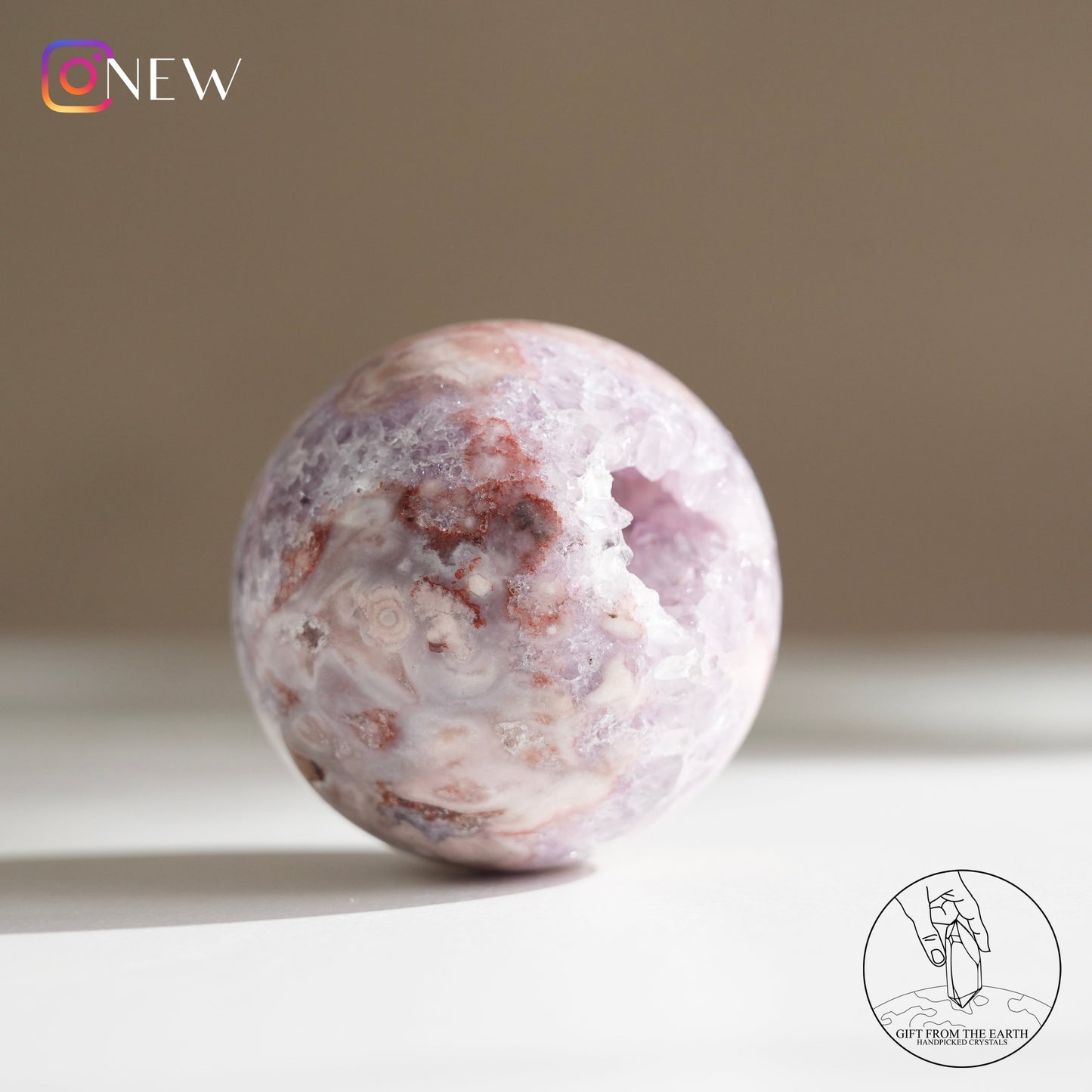 Brazilian pinkish amethyst with blossom agate sphere