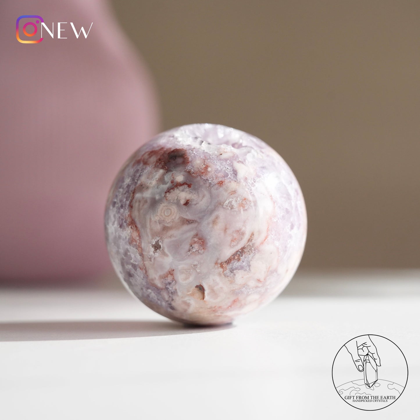 Brazilian pinkish amethyst with blossom agate sphere