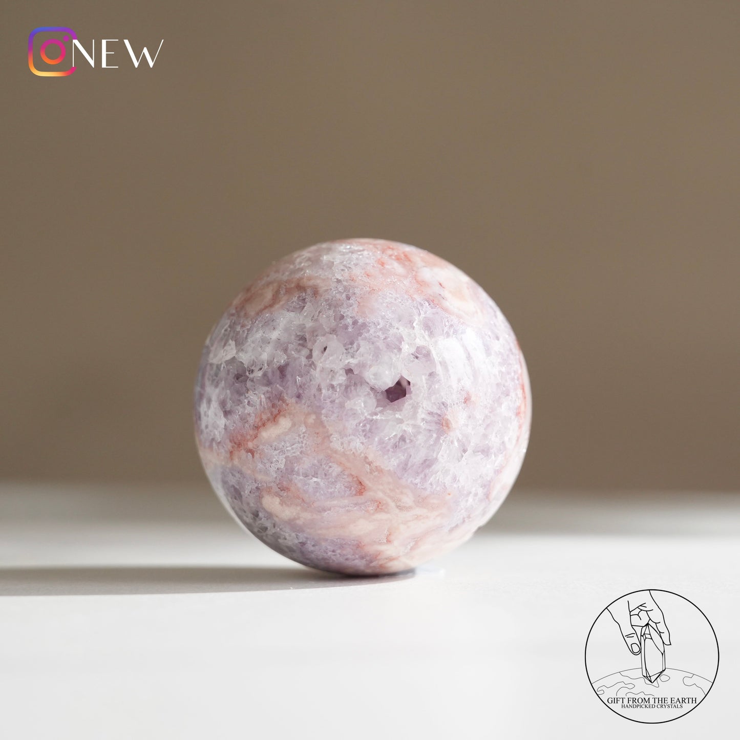 Brazilian pinkish amethyst with blossom agate sphere