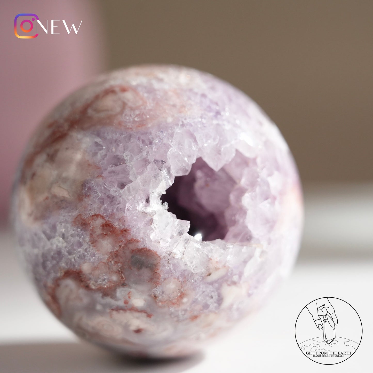 Brazilian pinkish amethyst with blossom agate sphere