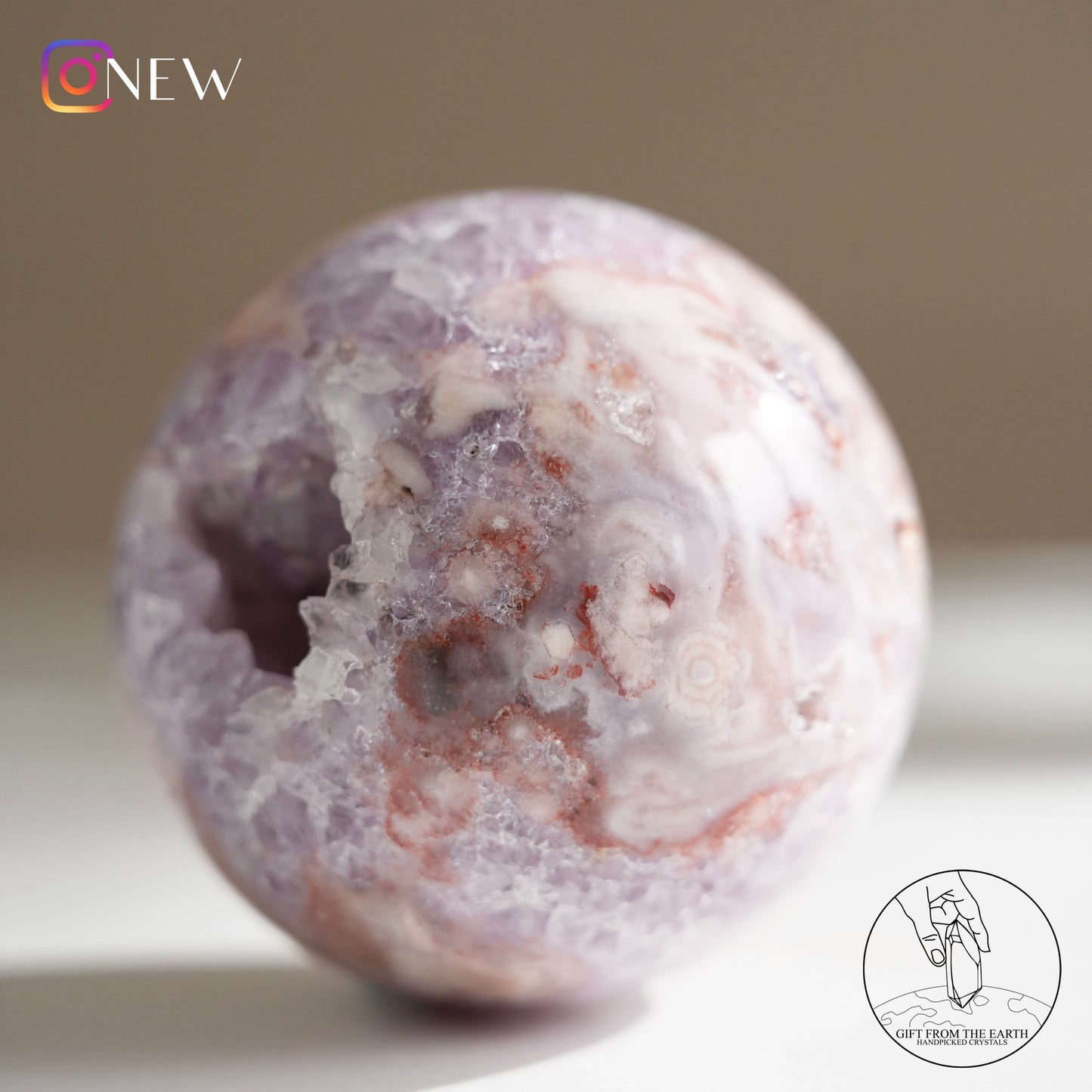 Brazilian pinkish amethyst with blossom agate sphere