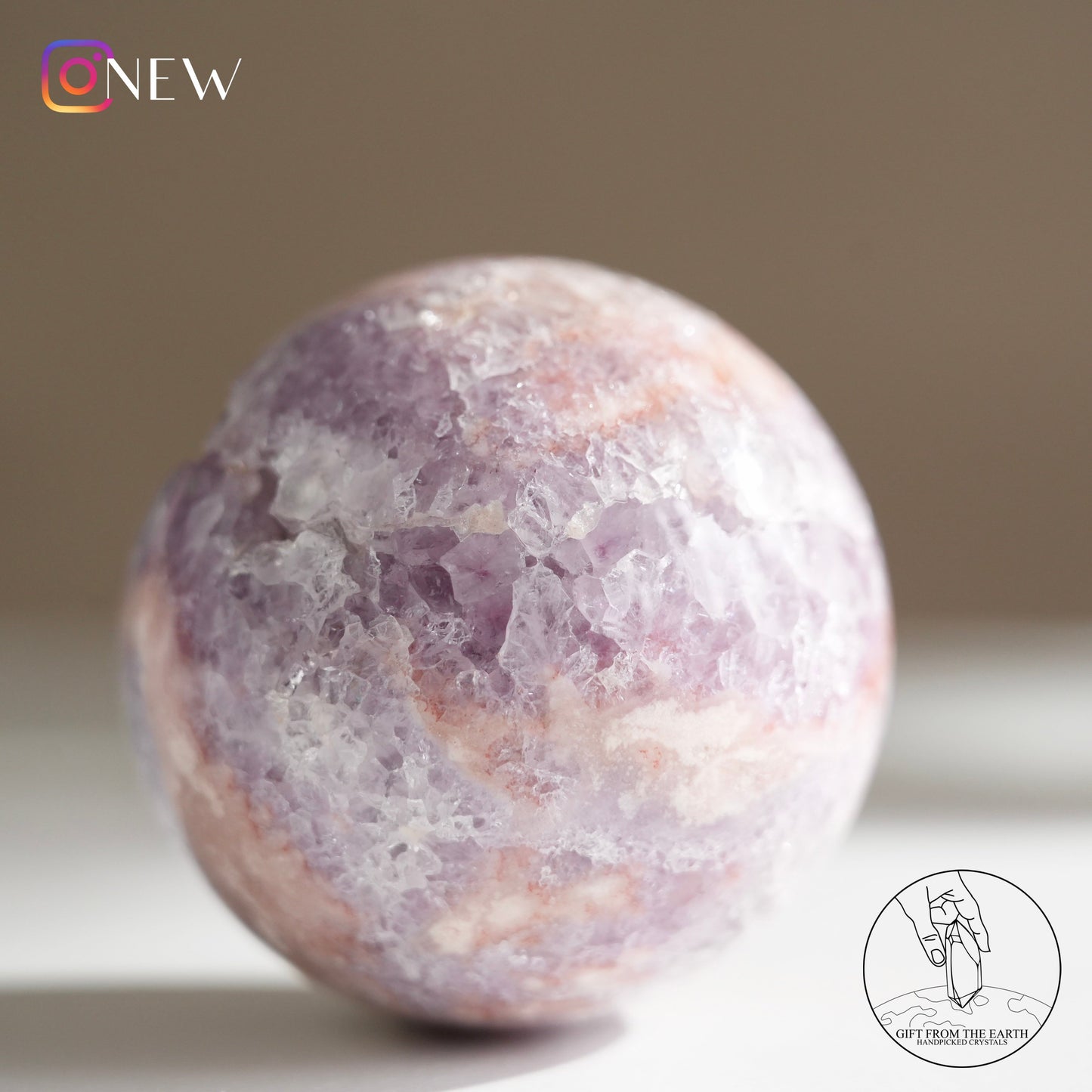 Brazilian pinkish amethyst with blossom agate sphere