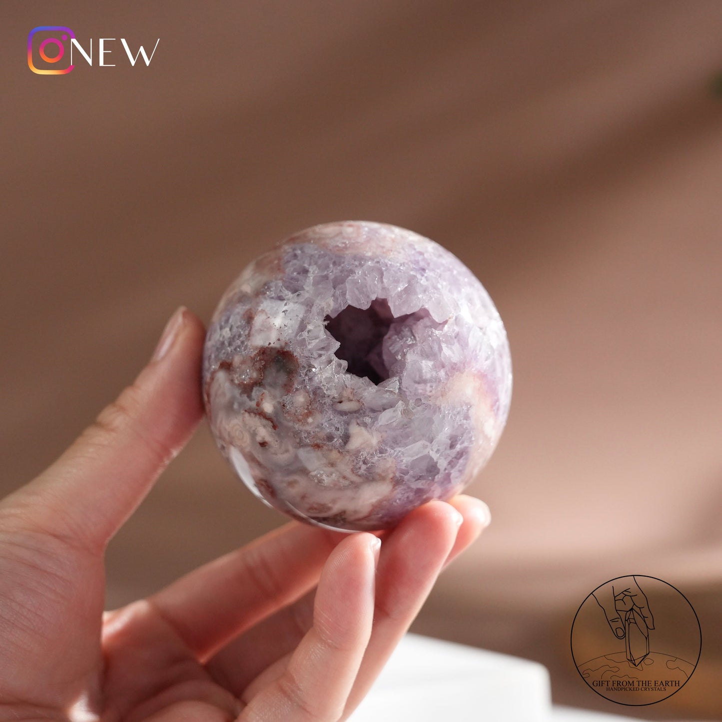 Brazilian pinkish amethyst with blossom agate sphere