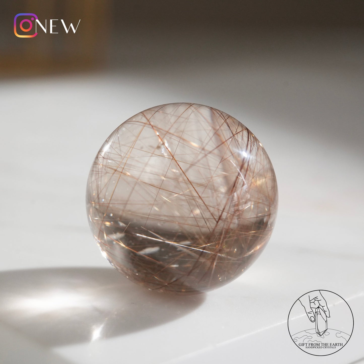 Golden rutilated quartz sphere