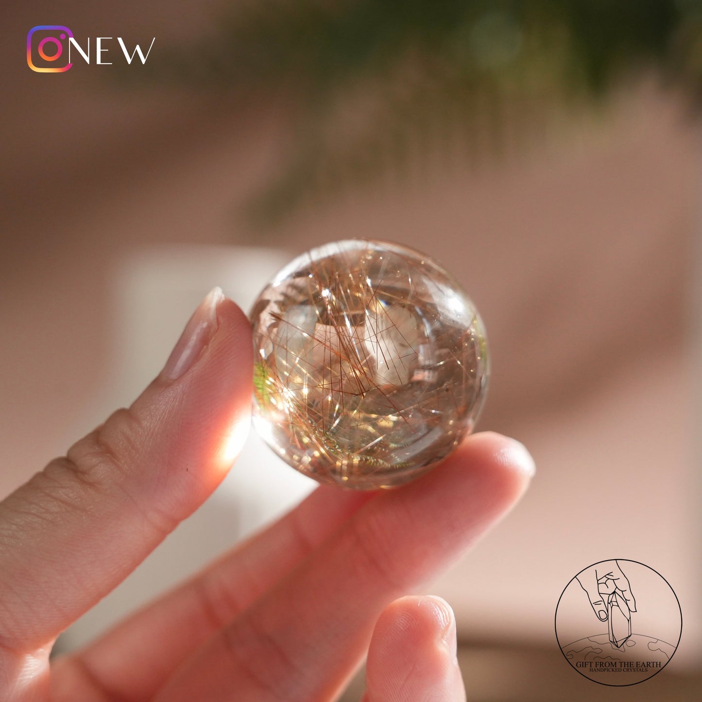 Golden rutilated quartz sphere