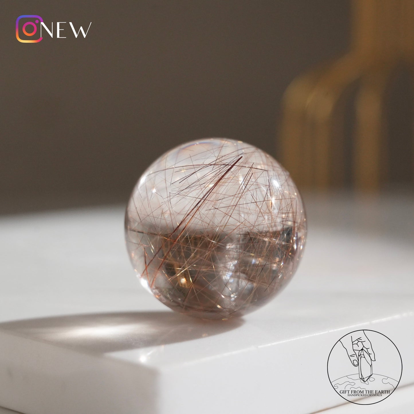 Golden rutilated quartz sphere