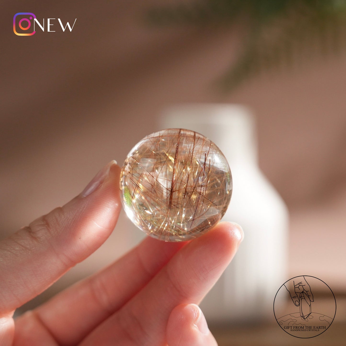 Golden rutilated quartz sphere