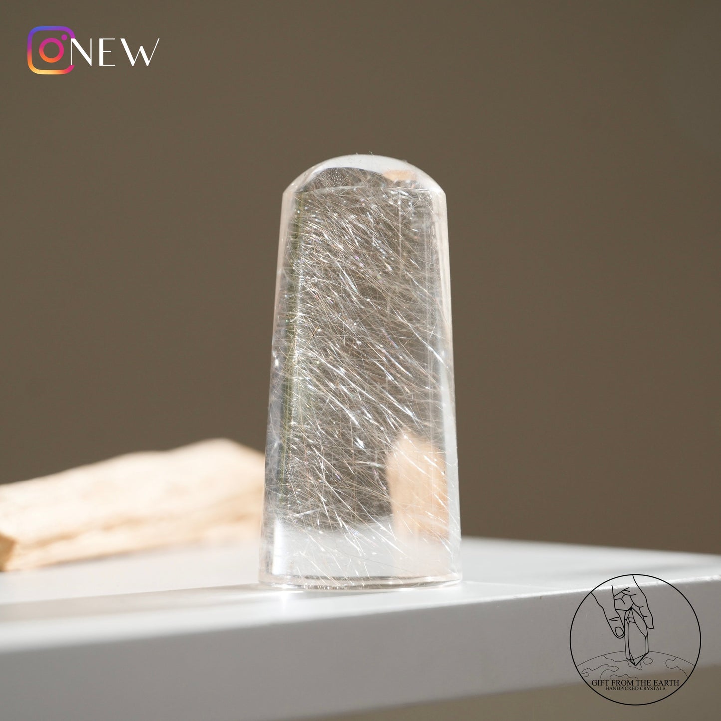 Silver rutilated quartz point