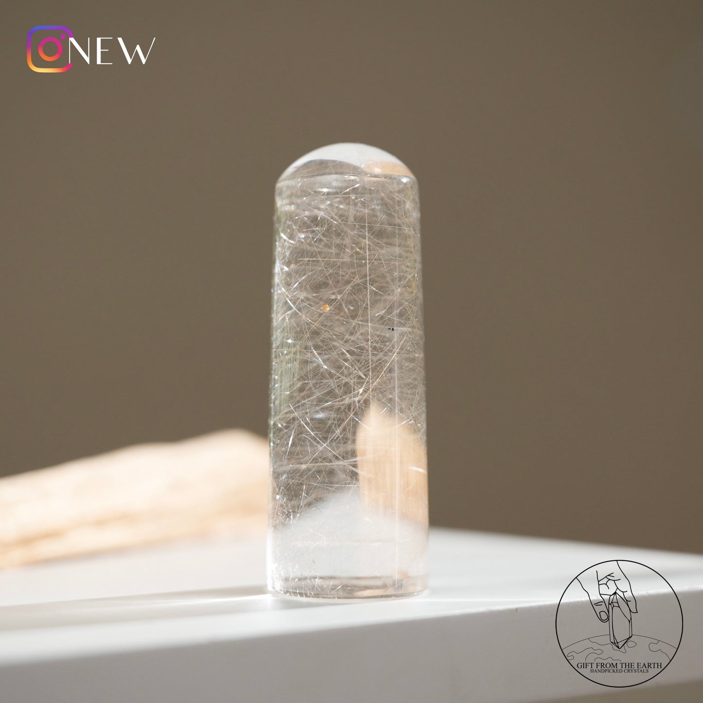 Silver rutilated quartz point