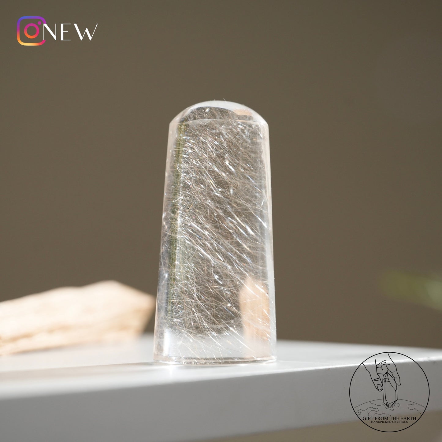 Silver rutilated quartz point